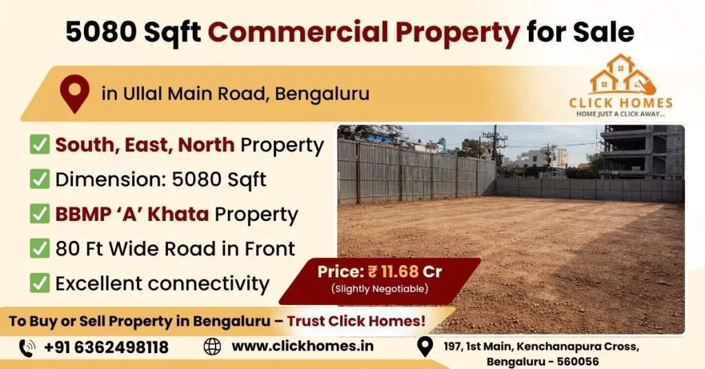 5080 Sqft Commercial Property for Sale in Ullal Main Road: Alt Text: A black hatchback parked on a dirt lot next to a high-rise cream-colored building wall, with multi-story residential apartments in the background under a blue sky. Caption: Finding value in every corner: A glimpse at a burgeoning residential pocket ready for new development.